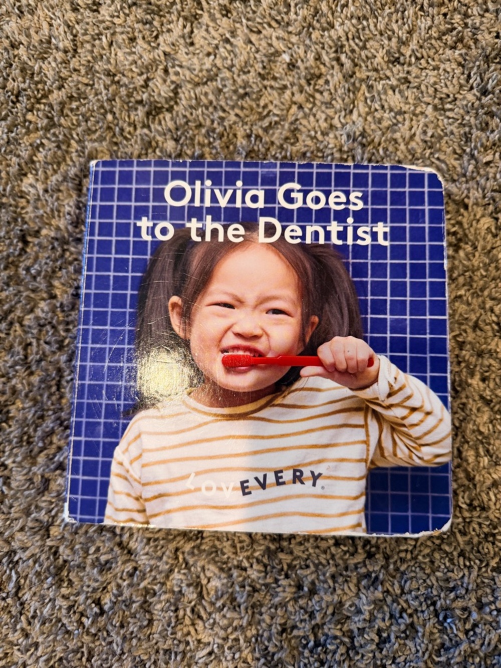 Lovevery Olivia Goes to the Dentist - Blue Cover Board Book